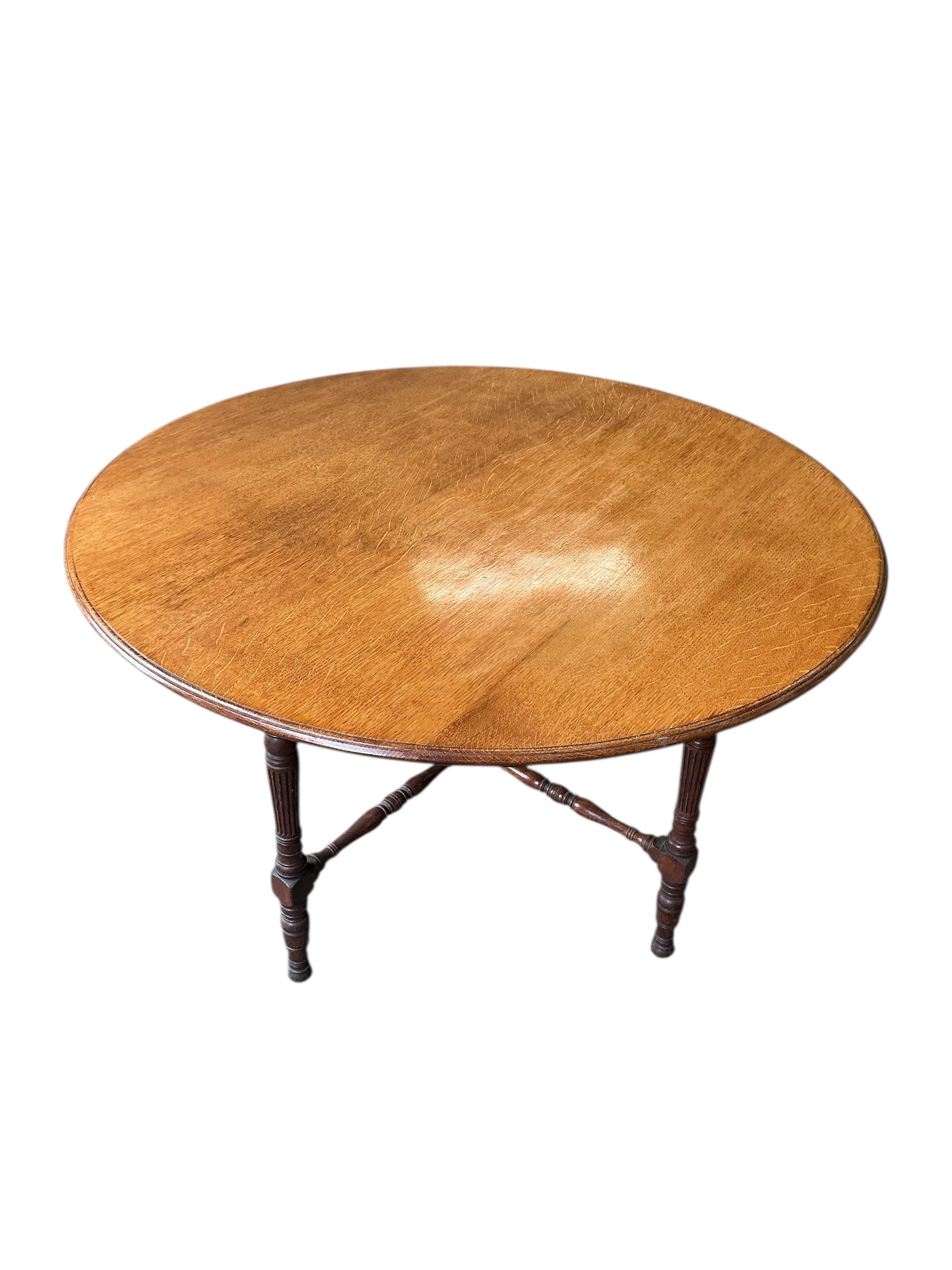 A late Victorian circular light oak breakfast table, diameter 120cm, height 72cm
